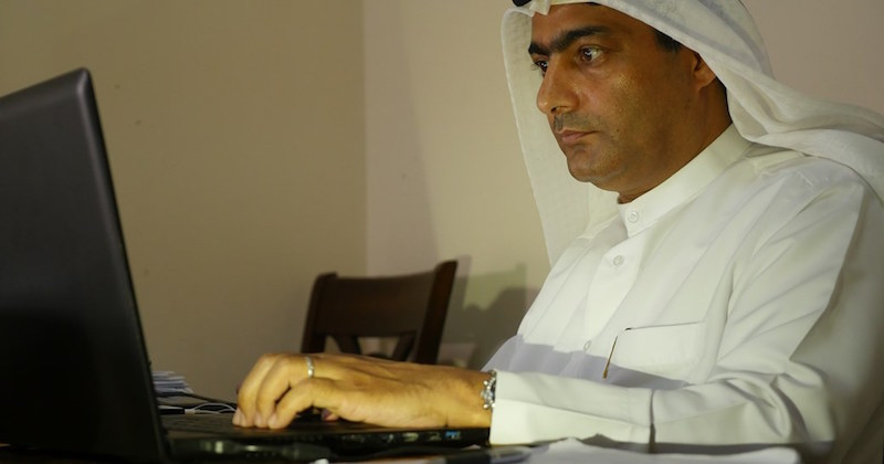 Ahmed Mansoor at computer