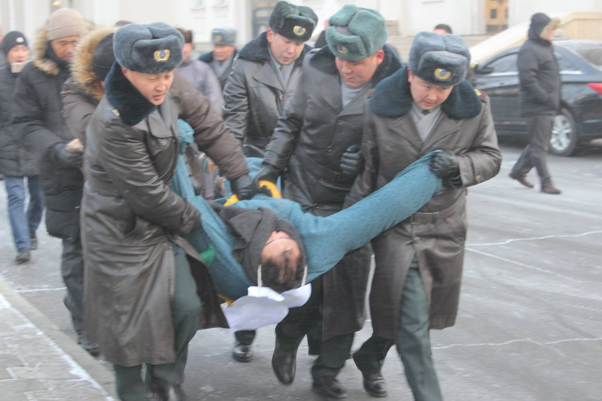 Mongolian police detain protester during a sit-in, March 2016
